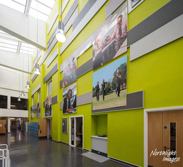 School interior with large prints of photographs