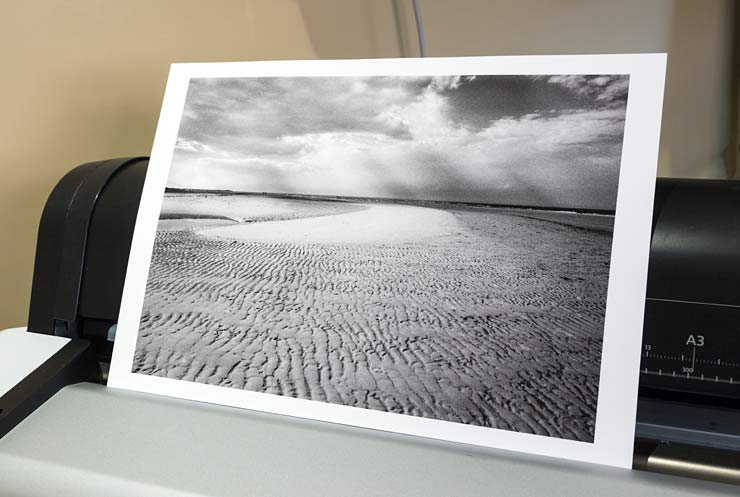 black and white print of Brancaster Bay