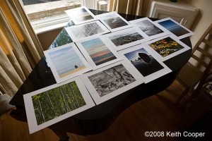 test prints drying on the top of a piano